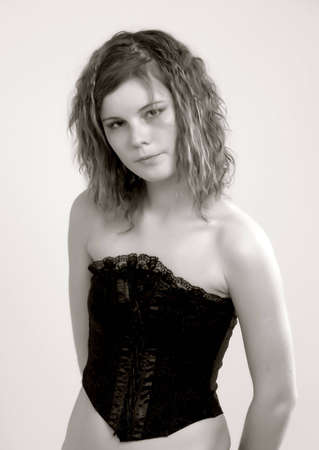 young attractive slim woman in black corset                               の写真素材