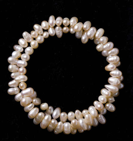 pearl bracelet over black velvetの写真素材
