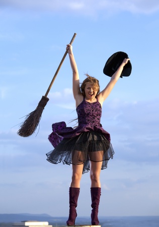 pretty witch with hat and broomの写真素材