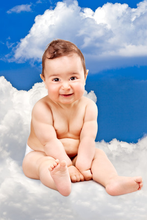 portrait of an adorable kid posing against a cloudy sky backgroundの写真素材