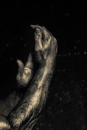 Close-up of a mans arm. Strong and power man's hand. Low key shoot.の写真素材