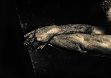 Close-up of a mans arm. Strong and power man's hand. Low key shoot.の写真素材