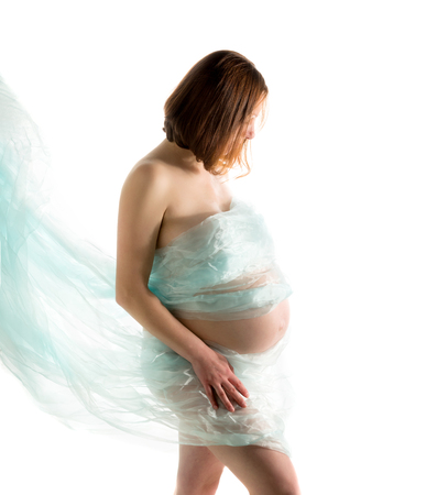 pregnant woman, expectant mother on white background, close-up of pregnant bellyの写真素材