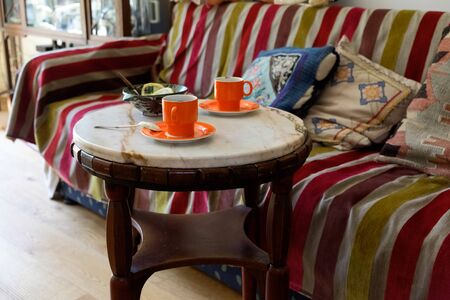 Romantic coffee table, two cups of coffee on a marble table in interior an classic house.の写真素材