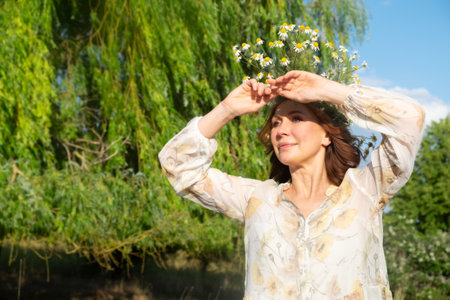 Beautiful romantic brunette adult woman posing outdoorsの写真素材