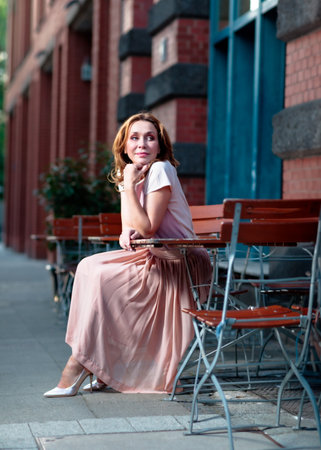 Beautiful successful middle aged woman posing on the street photo shootの写真素材