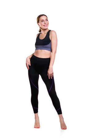 Gym Fitness. Smiling adult woman. Isolated over white backgroundの写真素材