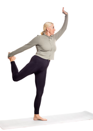 Woman Practicing Yoga: Flexibility and Balance for an Active Lifestyleの写真素材