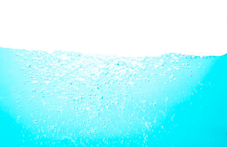 Blue water soda splash on isolated background and clean water for drinkの写真素材