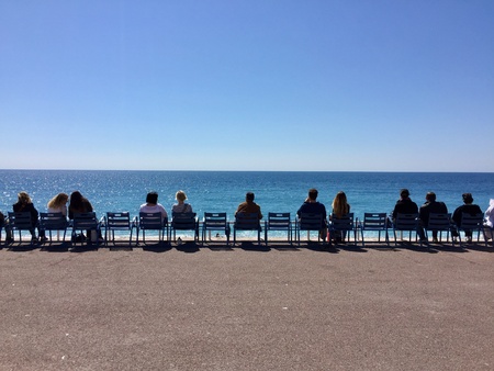 people sitting on chair to enjoy sea viewの素材