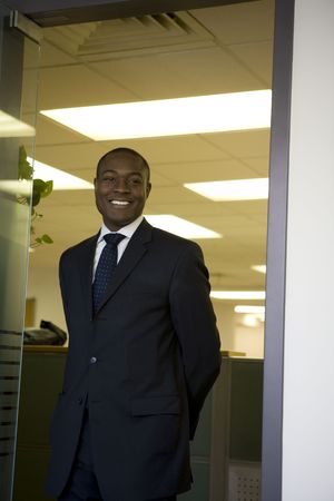 Businessman standing in office doorway