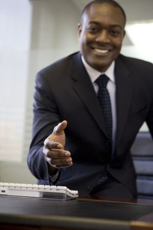 Businessman extending handの写真素材