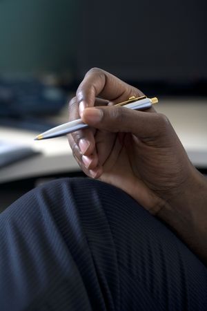 Close up of businessman holding penの写真素材