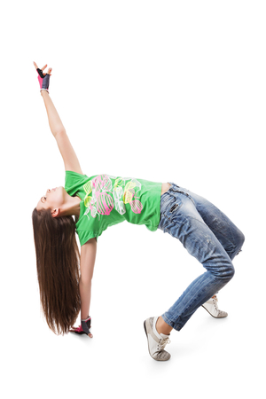 Modern hip-hop dance girl in bridge pose. Young go-go dance girl isolated on white backgroundの写真素材