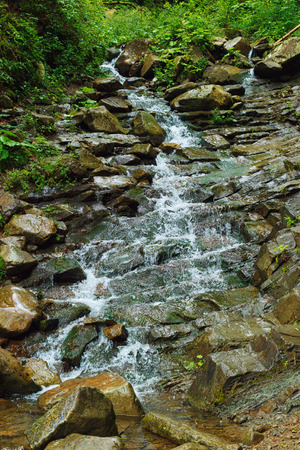 Mountan river stream on stonesの写真素材