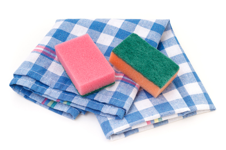 Kitchen cleaning sponges with checkered towel napkinの写真素材