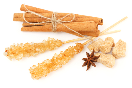Cinnamon, anise and cane sugar with crystal sugar sticksの写真素材