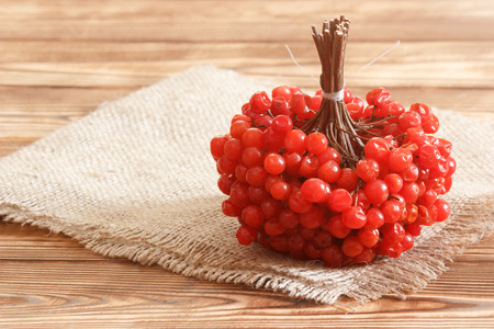 Viburnum berries brunch on burlap towel on tableの写真素材