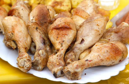 Baked chicken legs on plateの写真素材