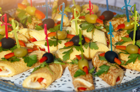Pancake rolls with skewers. Different salty fillings.の写真素材