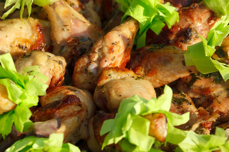 Chicken legs drumstick with paper napkins on event catering buffetの写真素材