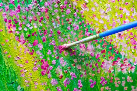 Oil painting process. Brush paint floral art on canvas.の写真素材