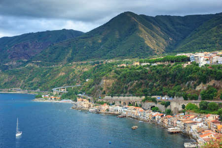 Scilla, Italy - September 7, 2019: The view on left side of Scilla town and mountains from ancient Ruffo castle. South Italy region of Calabria.のeditorial素材