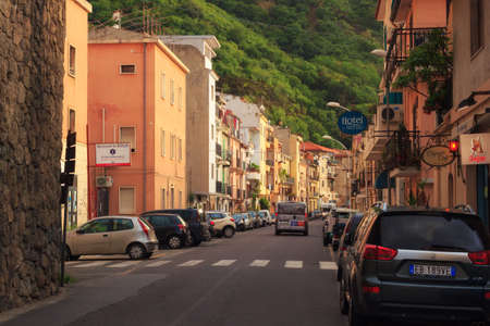 Scilla, Italy - September 7, 2019:  View on street of town with car parking and elegant buildings. Street near the train station of downtown.のeditorial素材
