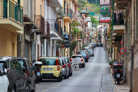 Scilla, Italy - September 7, 2019:  Central street of town with car parking and elegant buildings. Italian vacation.のeditorial素材