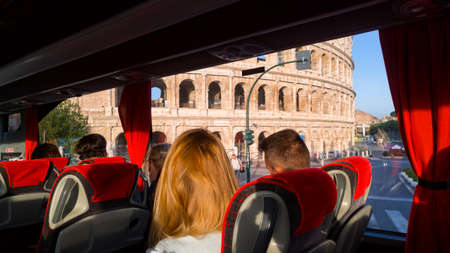 Rome, Italy - September 10, 2019: The view on Colosseum from the touristic bus interior with unknown peopleのeditorial素材
