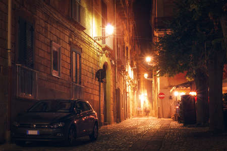 Tropea, Italy - September 6, 2019: Night illumination of Tropea town of South Italy. Ancient town street with warm light lanterns and romantic atmosphereのeditorial素材