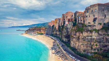 Tropea, Italy - September 10, 2019: Landscape with Tropea beach and old town buildings on mountain rock.のeditorial素材