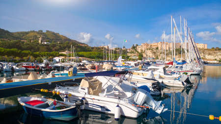 Tropea, Italy - September 9, 2019: Panorama of yacht port of Tropea town. View on port and green mountains 
landscape.のeditorial素材