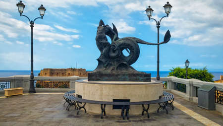 Scilla, Italy - September 8, 2019: The statue of Scylla and Charybdis with view on ancient Ruffo castle.のeditorial素材