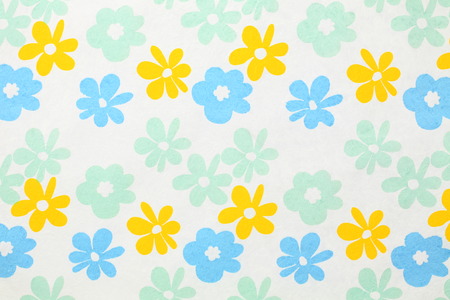 White paper with red, blue and green flowers for background