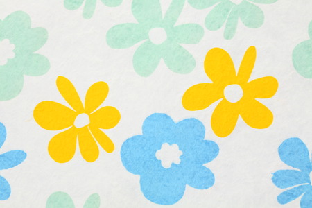 White paper with red, blue and green flowers for background