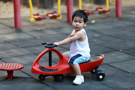 Young boy playing on playgroundの写真素材