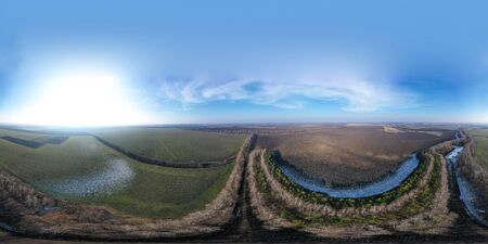 Top view in the middle of a icy river in the forest with yellow trees. Beautiful view from above....