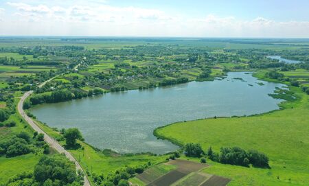 The blue water in the lake air shooting from the sky. Greens in the village. Lots of plants and...