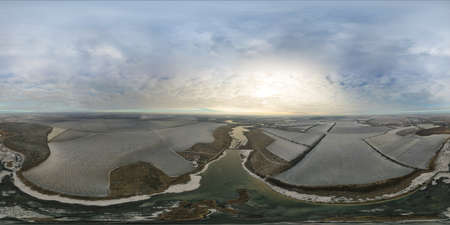 360 degree panorama top view from the air, river ice and white trees