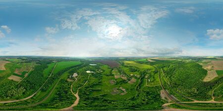 Beautiful panorama of green fields and meadows and two large lakes. A drone shot. Height 120 meters...