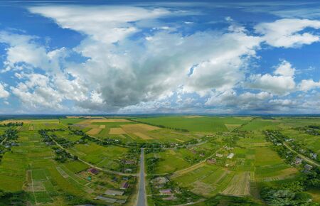 360-degree pano of Aerial view of a beautiful landscape with white clouds in the colorful sky