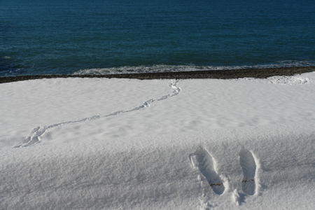 Footprints of a man in the snowの写真素材