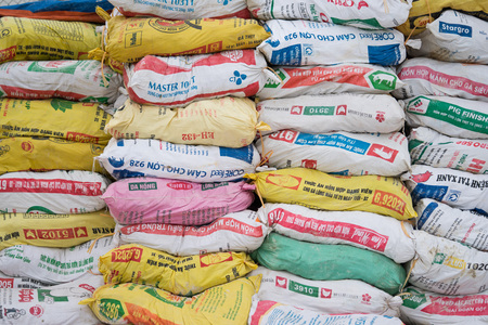 Hanoi, Vietnam - Jan 1, 2016: Many packages of many kinds of animal food for sale at an agricultural store in a rural area. Agriculture is the easiest industry to be hurt in Vietnam by TPP agreement.のeditorial素材