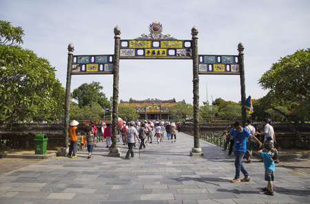 Hue, Vietnam - Jun 16, 2016: Visitors coming to see the Imperial Royal Palace of Nguyen dynasty at Ngo Mon gate. This gate is one of the forbidden city main gates.のeditorial素材