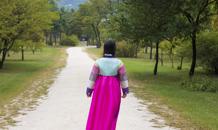 Beautiful girl in Hanbok at Gyeongbokgung, the traditional Korean dressの写真素材