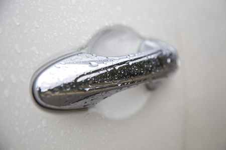 Silver car door handle knob, close upの写真素材