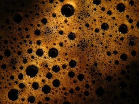 Coffee with foam bubbles, abstract shadowsの写真素材