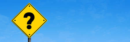 Yellow road sign with Question Mark in panoramic blue sky background. Business question concept ideaの写真素材