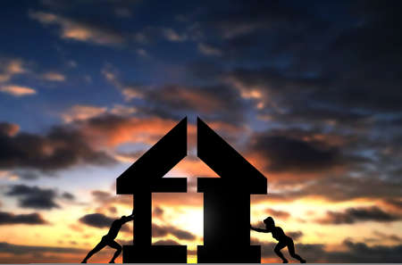 Couple Connect Two Pieces of House To complete building it. Conceptual Photo of man and woman build a house, sunset sky background with conceptual people shiltuetteの写真素材